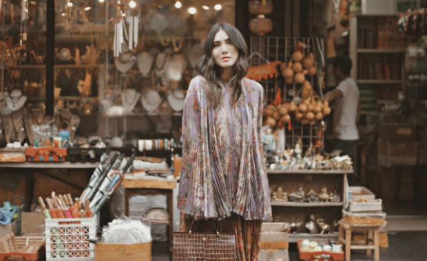 influencer standing in front of a shop