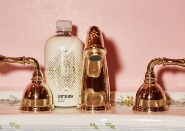 lotion on a sink with taps